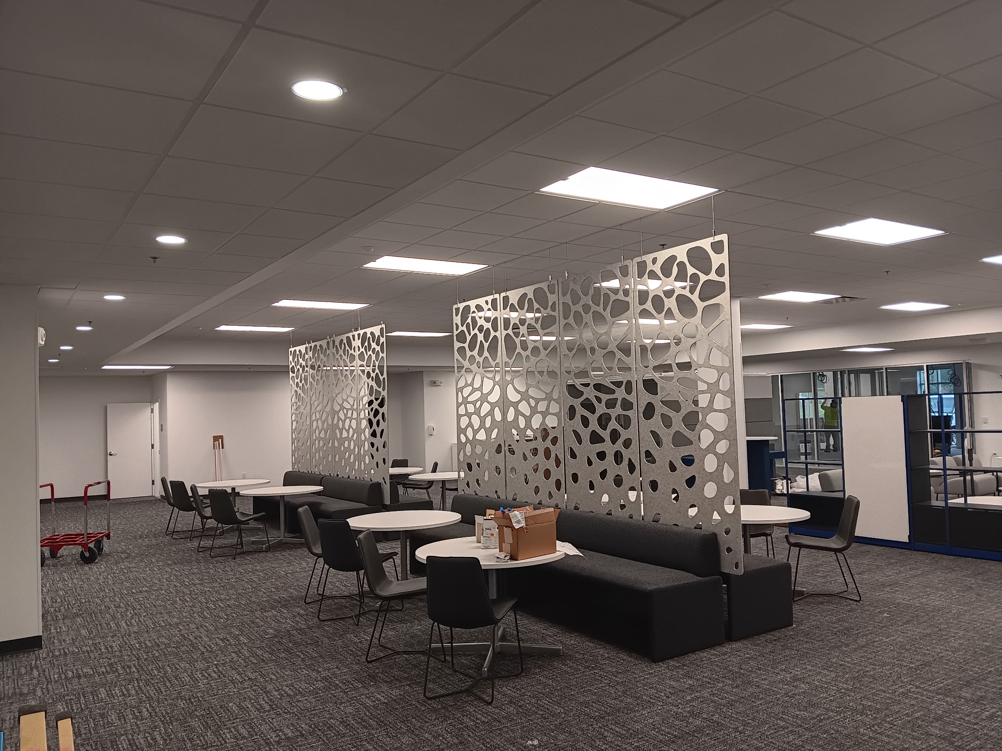 Lounge sofas and chairs arranged around round tables